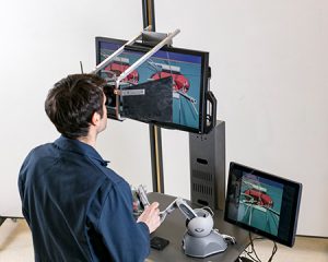 A year in development, the visual simulator, pictured here, aims to reduce by six months the training time to learn the PEA procedure. (Photo: Courtesy Bayer)
